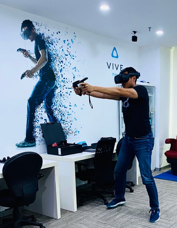 Alvin testing a social shooter game on the Vive Focus 3 before launch at the Beijing Vive Lab in April 2021