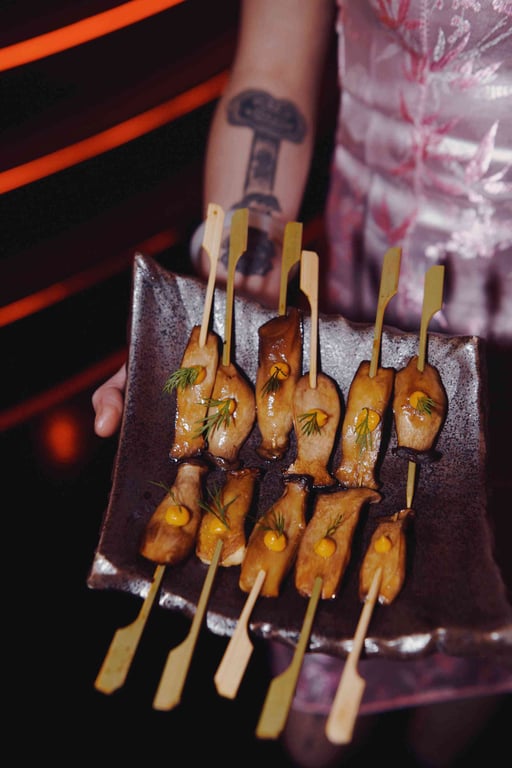 Zoey Gong serving a TCM dish of matsutake skewers