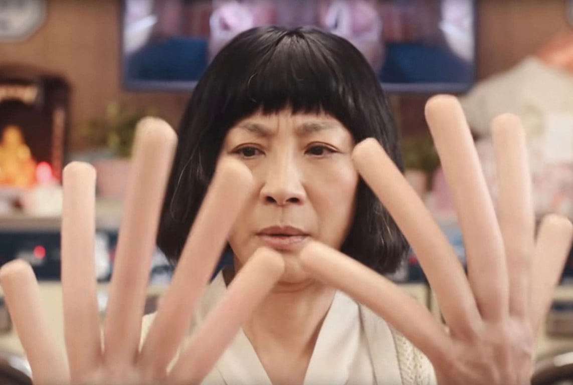 michelle yeoh's evelyn with hot dog fingers in everything everywhere all at once