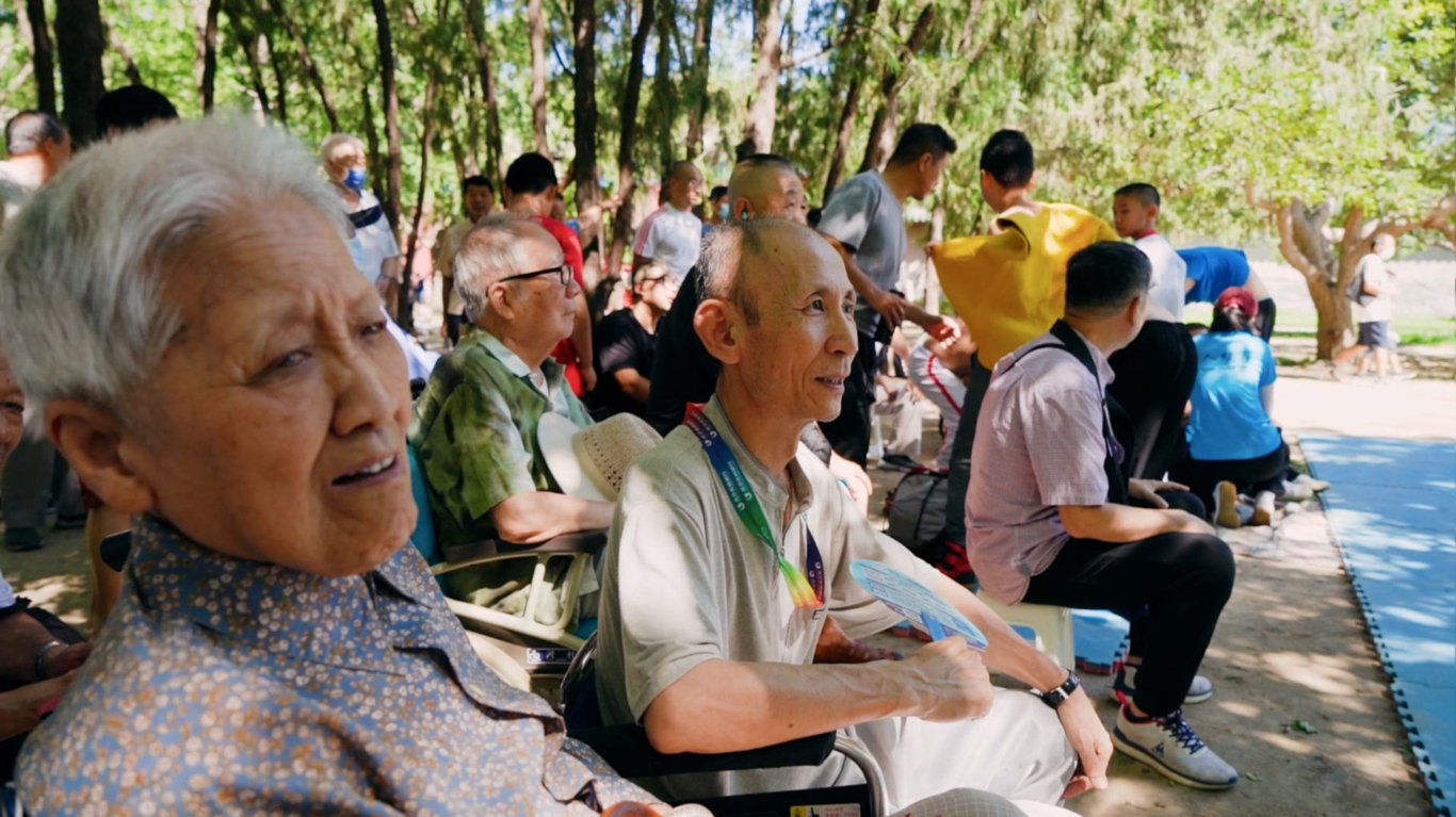 Spectators watch Beijing-style wrestling