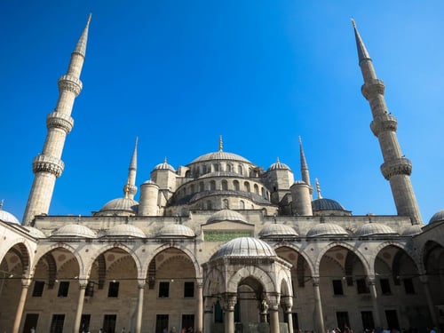 a large building with towers with Sultan Ahmed Mosque in the background