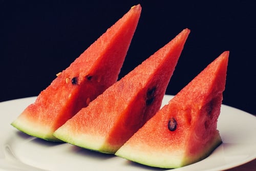 a group of watermelon slices on a plate