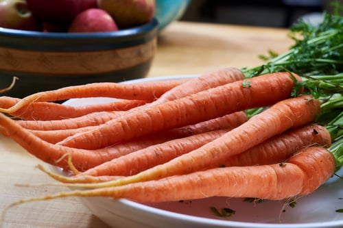 a bunch of carrots on a plate