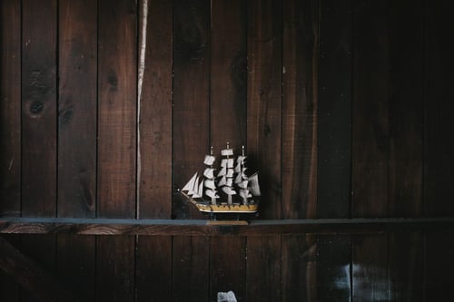 a model of a ship on a shelf