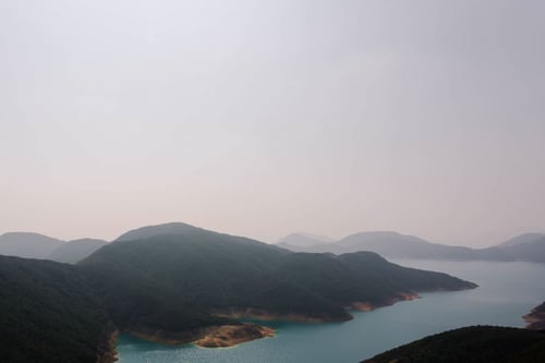 a body of water with hills and a body of water