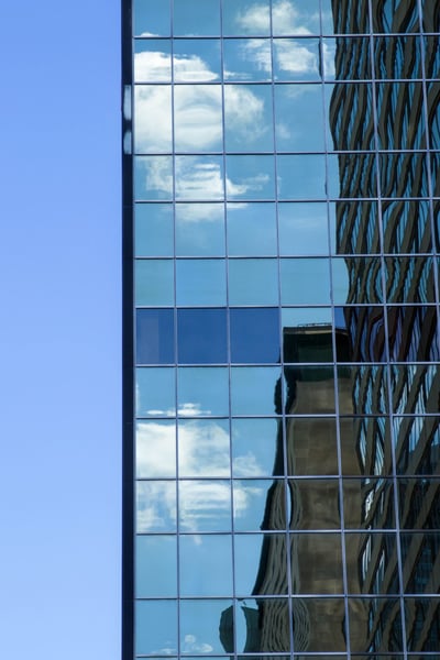 a reflection of clouds in a building