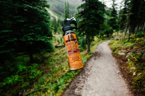 a spray can on a trail