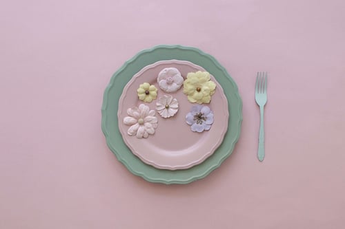 a plate with flowers on it and a fork