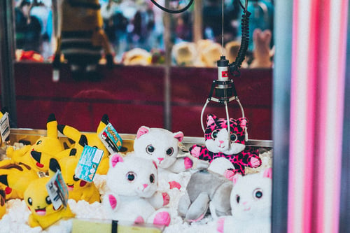 a group of stuffed animals in a machine