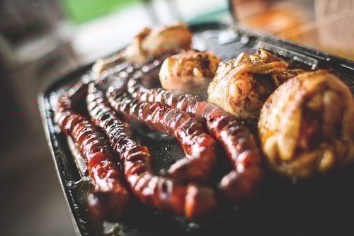 a grill with meat and sausages
