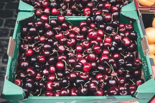 a group of cherries in a box