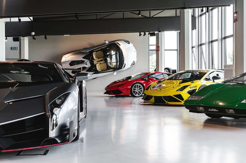 a group of cars in a showroom