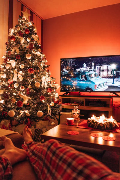 a christmas tree with lights and a tv