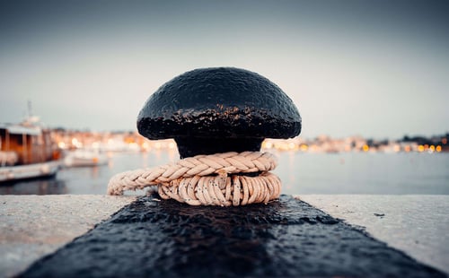a rope wrapped around a black round object