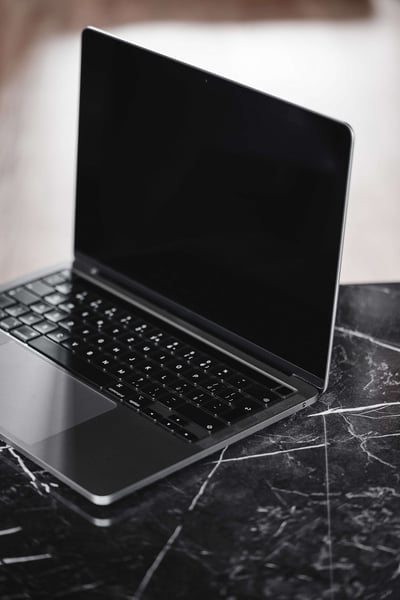 a laptop on a marble surface