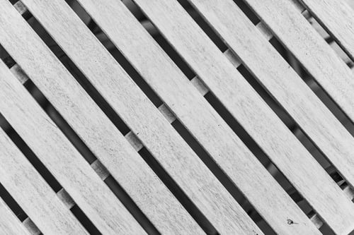 a close up of a white wooden slat