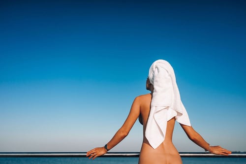 a woman with a towel on her head