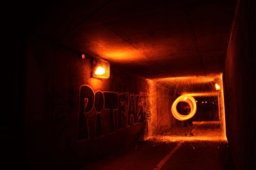 a person in a tunnel with sparks