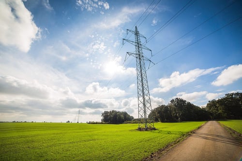 a power line tower in a field