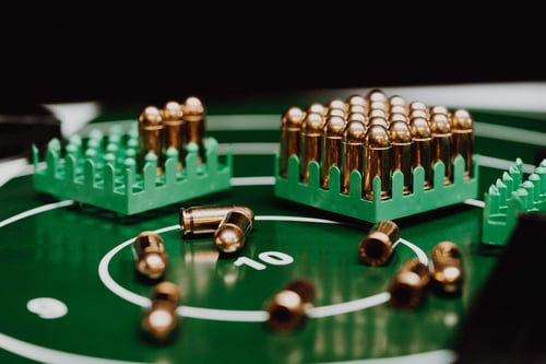 a group of bullets on a green board