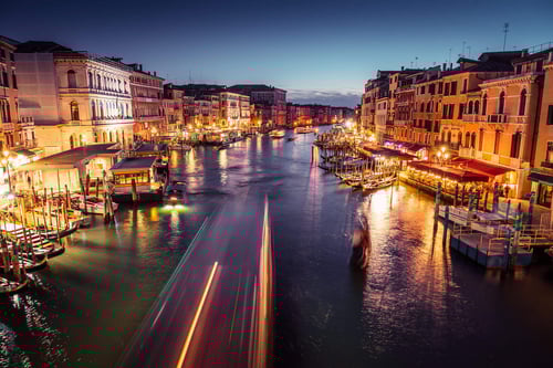 a city with boats and buildings