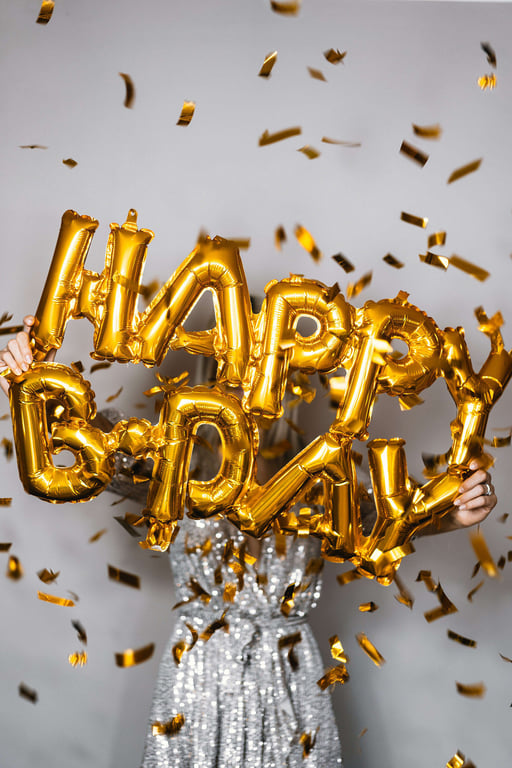 Woman Holding Happy Birthday Balloons