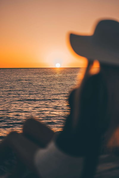 a person looking at the sunset