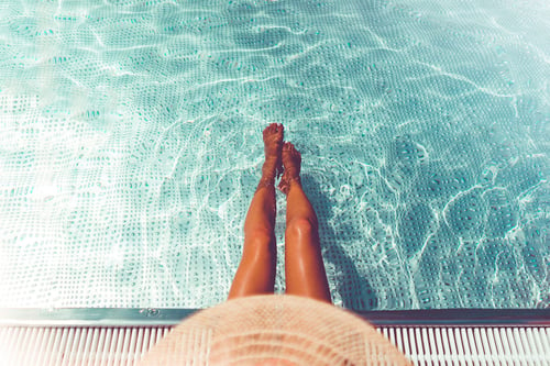 a person's legs in a pool