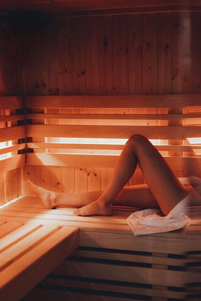 a person's legs in a sauna