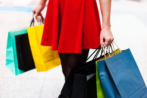 a woman holding shopping bags