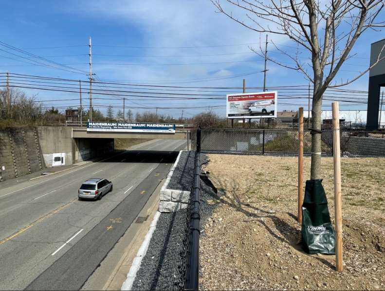 Westbury, Hicksville area, on east side Charlotte St, south of LIRR overpass, facing south Media