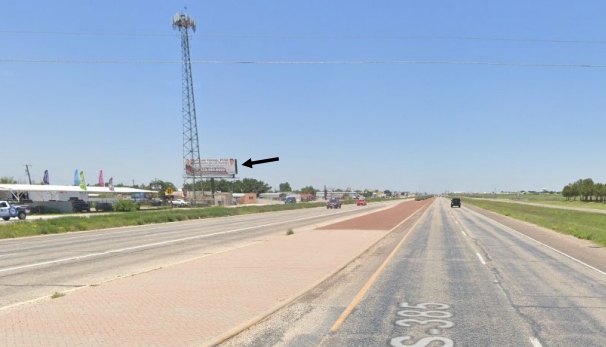 On Andrews Hwy. west of Vermont, near big tower Media