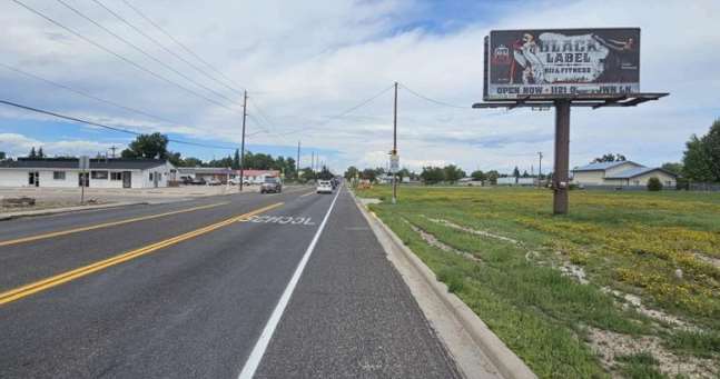 Location photo for Ridge Rd near Holmes & Ridge Rd - Bus Stop Sign (Cheyenne)