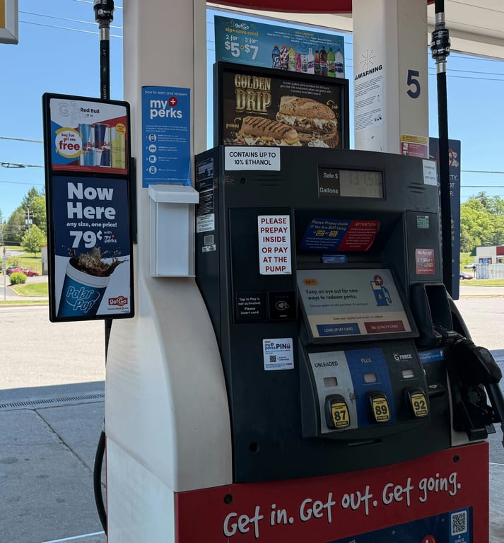 Gas pump advertising in out-of-home (OOH) advertising shown by gas pump with ads