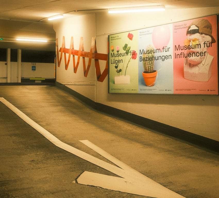 Parking garage advertising in out-of-home (OOH) advertising shown by posters alongside driving ramp