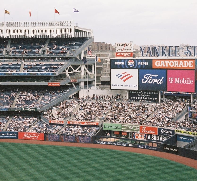 Arena advertising in out-of-home (OOH) advertising at Yankee stadium with brand signs