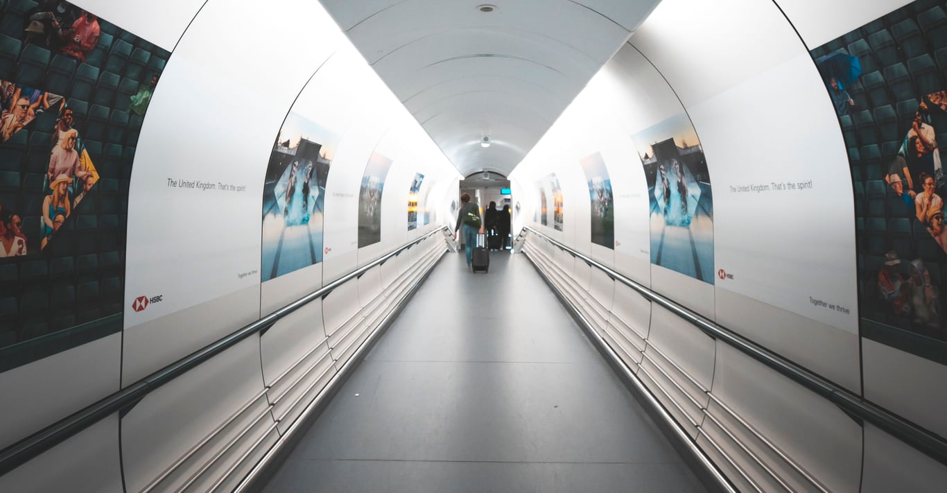 Jet bridge advertising in out-of-home (OOH) advertising with static signs and passengers