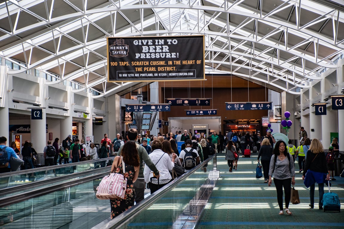 Airport media in out-of-home (OOH) advertising depicted by brewery sign in terminal
