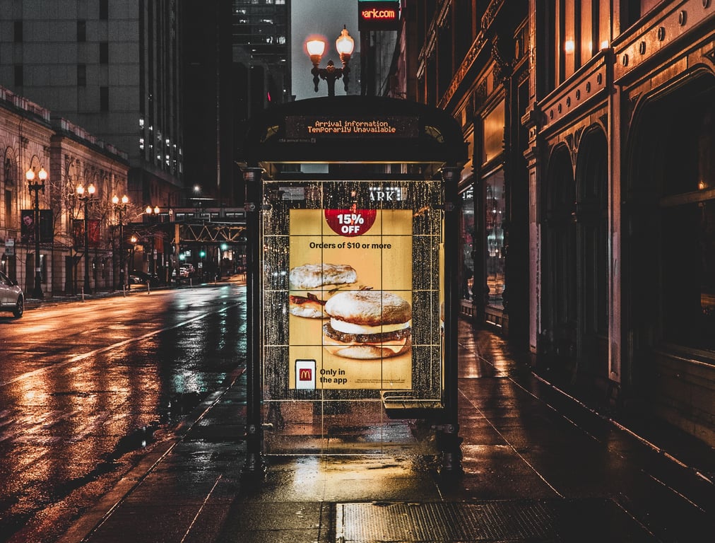 Pedestrian panel in out-of-home (OOH) advertising with mcdonalds ad on side of bus stop