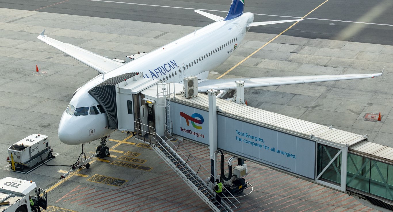 Jet bridge wrap in out-of-home (OOH) advertising depicted by wrap on side of jet bridge exterior attached to plane