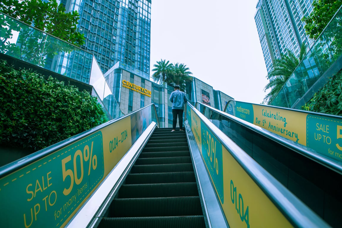 Escalator wrap in out-of-home (OOH) advertising shown outdoors