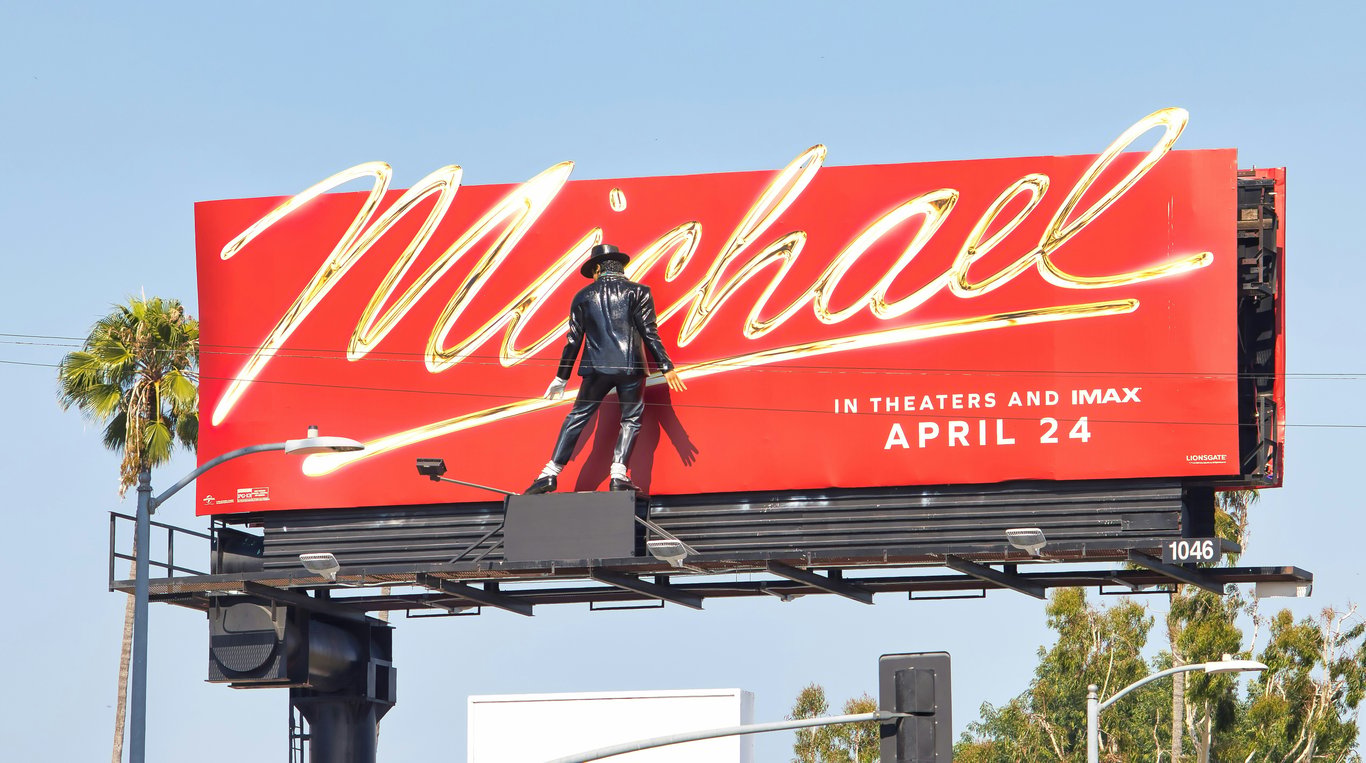 3D billboard in out-of-home (OOH) advertising depicted by statue figure in front of billboard