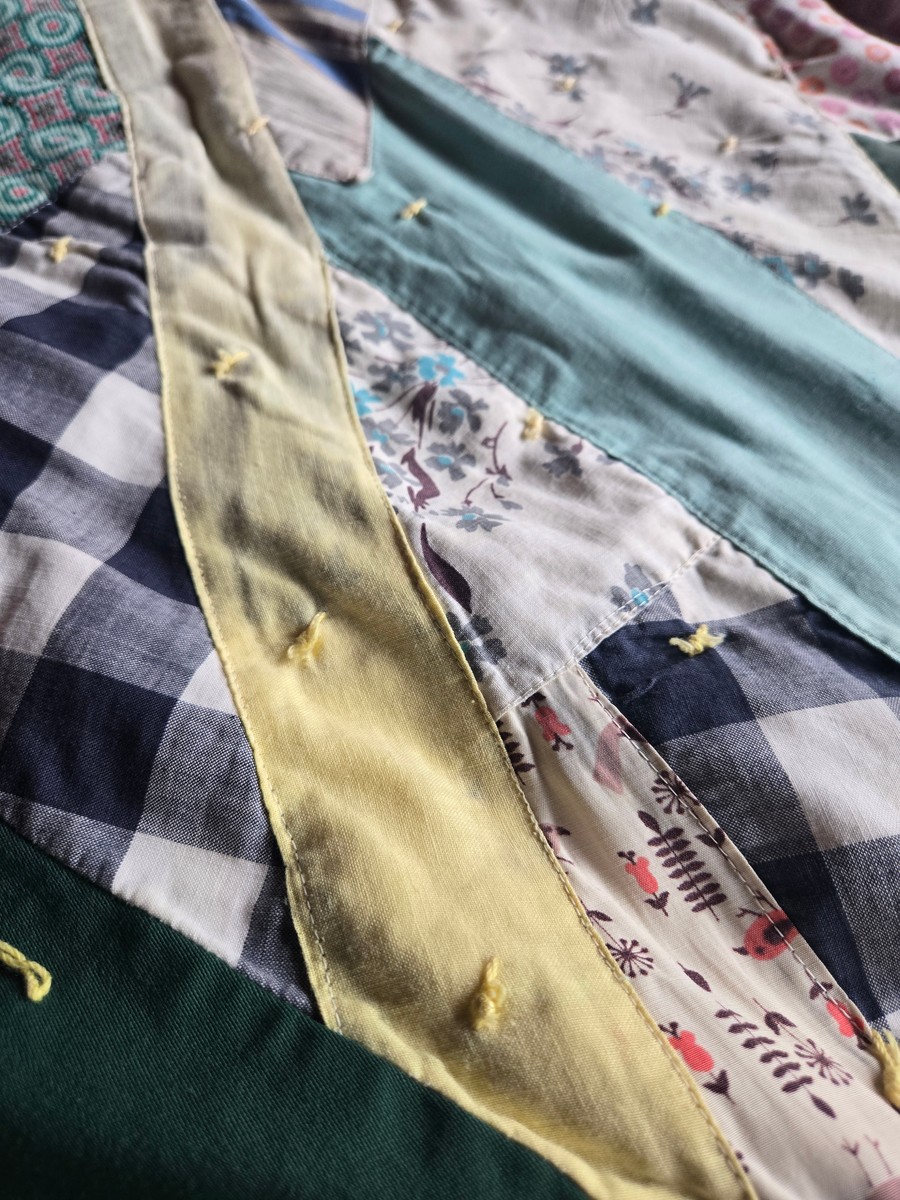 various fabrics stitched together into a quilt