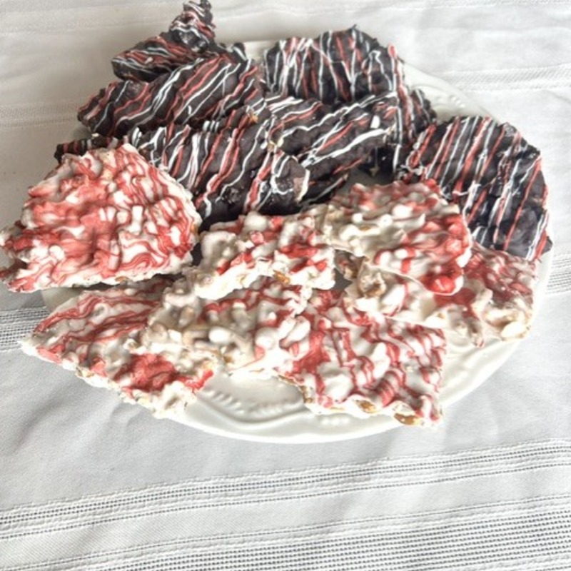 Handcrafted pretzel bark in white and dark chocolate with festive red and white drizzle by Bite Sized Smiles Co. Fishers Indiana