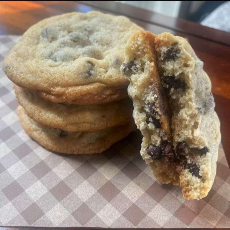 Stack of chocolate chip cookies on parchment
