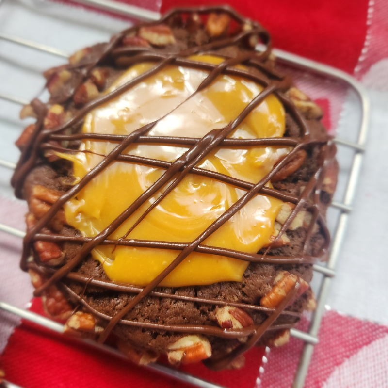 Photo of Turtle Cookie with a caramel center and dark chocolate drizzle