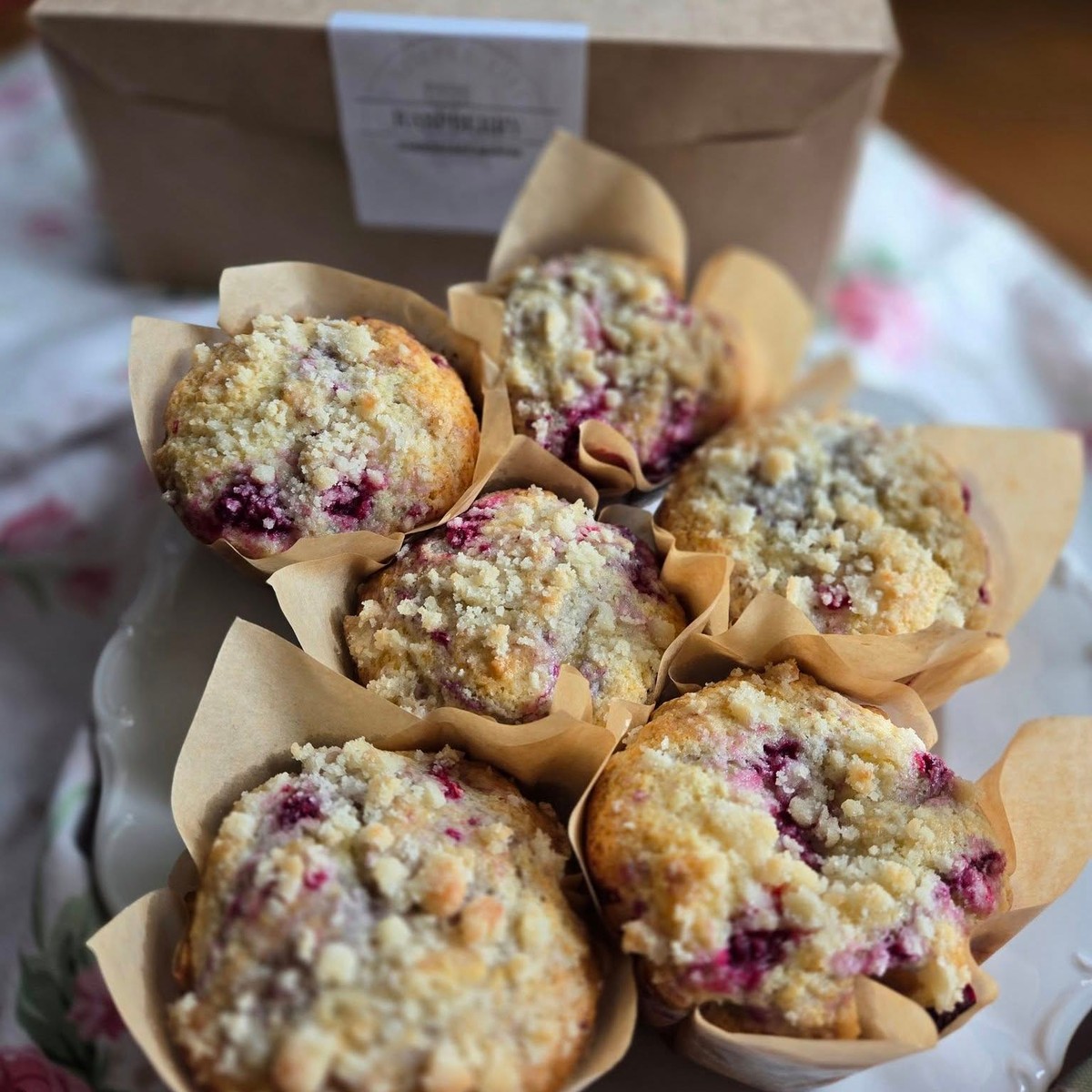 photo of raspberry cheesecake muffins on a plate