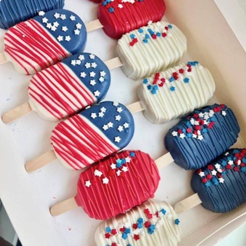 Patriotic custom Cakesicles decorated in red, white, and blue chocolate with festive sprinkles by Bite Sized Smiles Co. Fishers Indiana