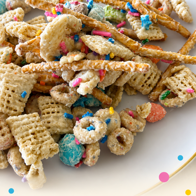 Photo of Classroom Crunch Snack Mix - rice cereal, pretzels, cheerios, marshmallows and chocolate candies covered in white chocolate