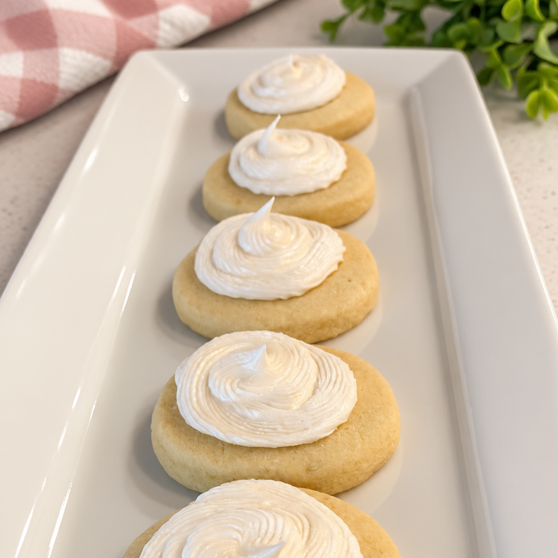Row of almond flavored sugar cookies with an almond icing swirl